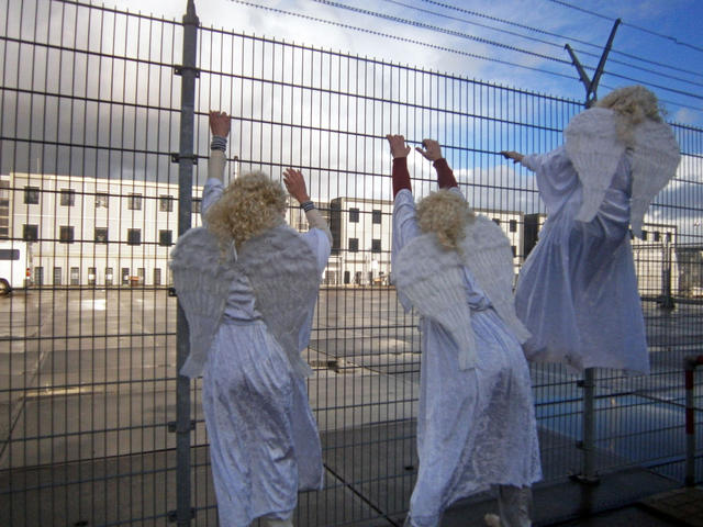 Angels without borders landed near Detention Centre Zaandam on Dec. 18th 2011. The angels wished the people without papers (detained in the boats) a Free New Year! Photo: Karen Eliot