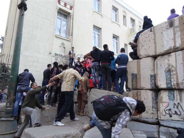 Saturday, November 24th 2012 in Cairo, Egypt: courageous people taking one of the police barricades in the area near Tahrir Square. Photograher: Salavila