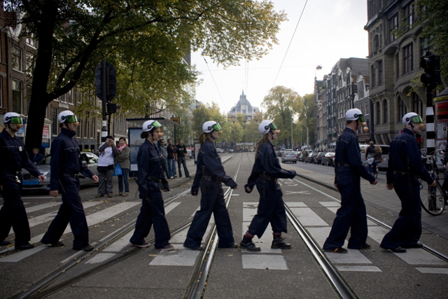 Oct. 11th 2008: Piggy Riot Police marching home after giving a demonstration at a police recruitment event at the Dam Square in Amsterdam. Photo: Gabriel Eisenmeier